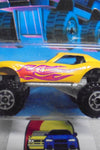 1986 HOT WHEELS TRAILBUSTERS YELLOW MONSTER VETTE UNPUNCHED CARD