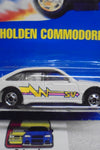 HOT WHEELS 1990 WHITE HOLDEN COMMODORE ON INTERNATIONAL BLUE CARD