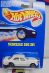 HOT WHEELS 1990 WHITE MERCEDES 380 SEL ON INTERNATIONAL BLUE CARD