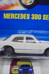 HOT WHEELS 1990 WHITE MERCEDES 380 SEL ON INTERNATIONAL BLUE CARD