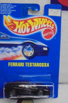 HOT WHEELS 1990 BLACK FERRARI TESTAROSSA ON INTERNATIONAL BLUE CARD