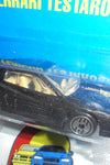 HOT WHEELS 1990 BLACK FERRARI TESTAROSSA ON INTERNATIONAL BLUE CARD