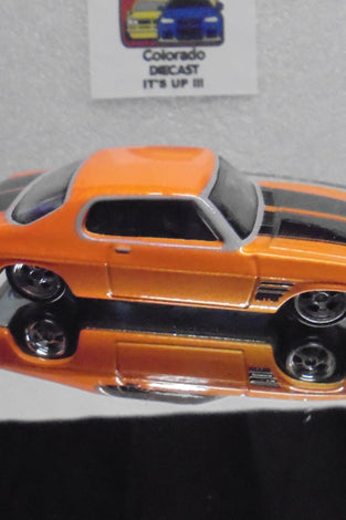 LOOSE HOT WHEELS ORANGE '73 HOLDEN MONACO GTS w/REAL RIDERS