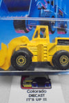 1986 HOT WHEELS WORKHORSES YELLOW CAT WHEEL LOADER UNPUNCHED CARD