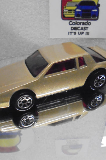 LOOSE HOT WHEELS GOLD CHEVY STOCKER w/RED INTERIOR & 7 SPOKE WHEELS