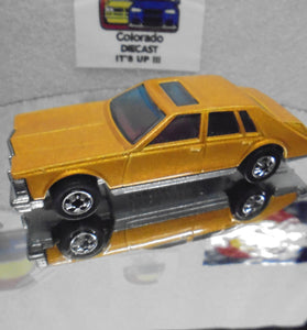 Loose Hot Wheels Gold Cadillac Seville w/Blackwalls