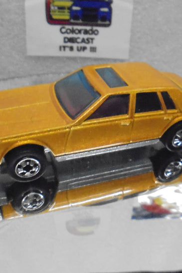 Loose Hot Wheels Gold Cadillac Seville w/Blackwalls