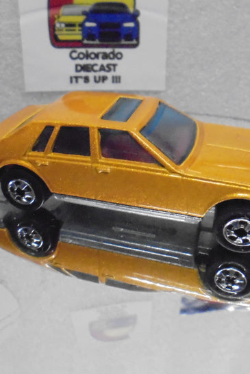 Loose Hot Wheels Gold Cadillac Seville w/Blackwalls