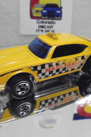 Loose Hot Wheels Yellow Maxi Taxi w/Blackwalls
